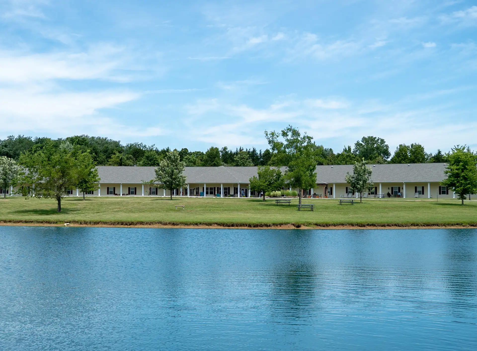 Missouri drug rehab center main building with lake in front