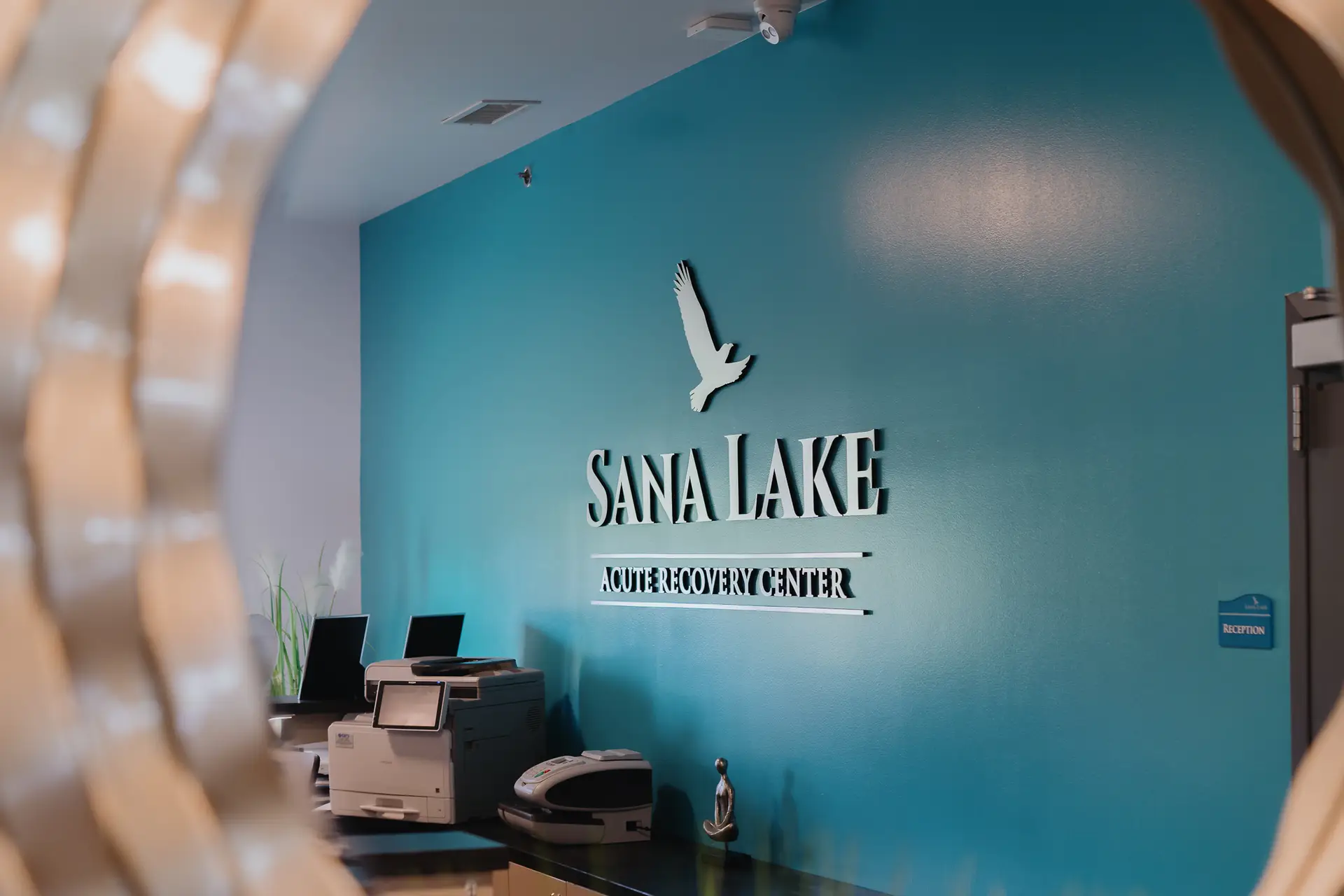 Detox main enteryway with Sana Lake logo on wall